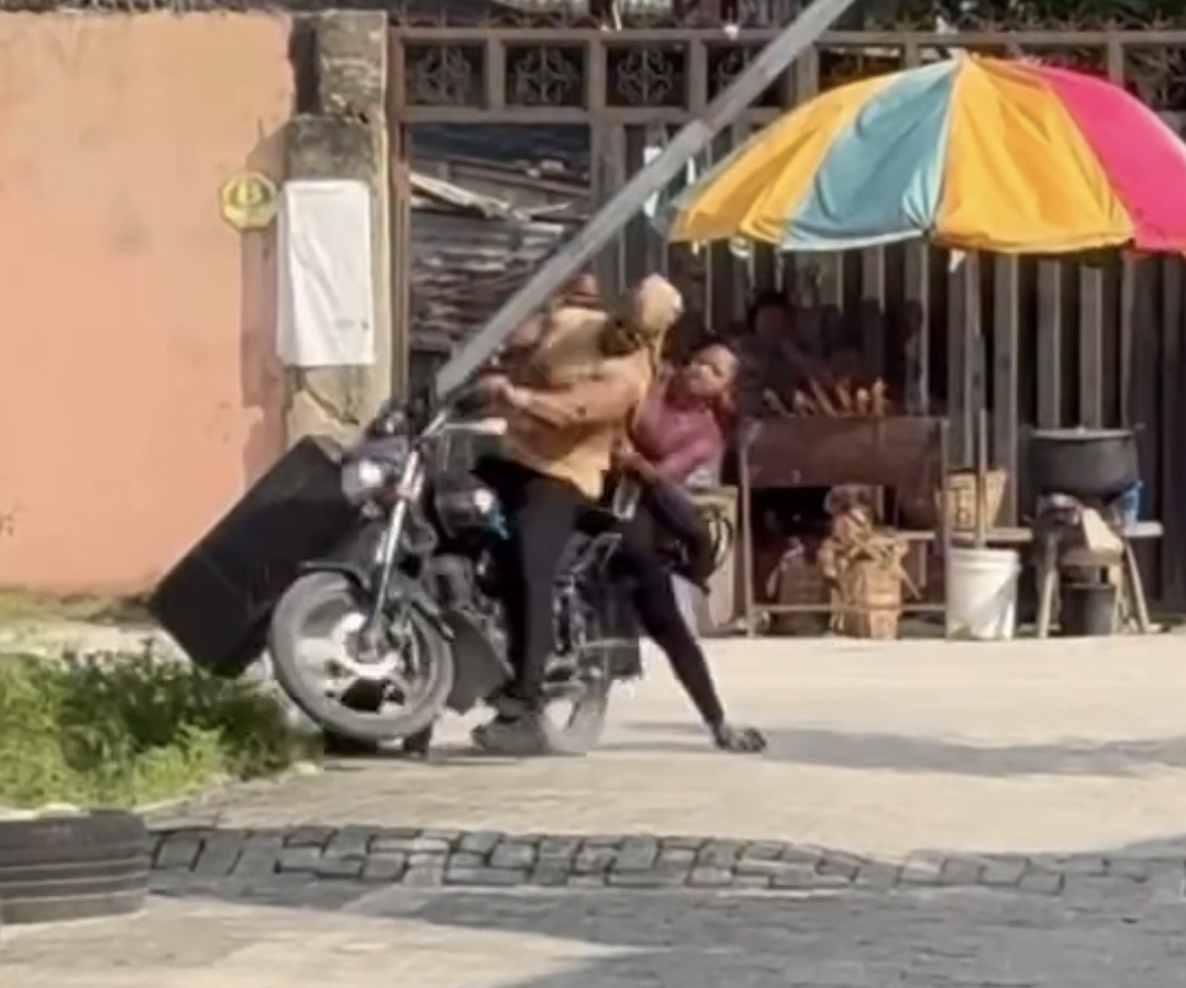 Moment actress Omeche Oko falls from bike on movie set, leaving her injured (video)