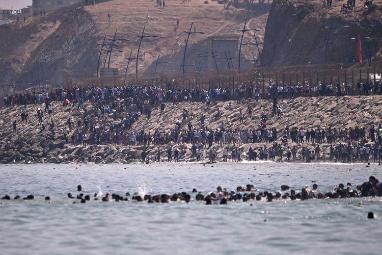 Spain deploys military as thousands of migrants from Morocco force their way into border city