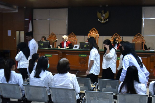 Nineteen members of child trafficking ring jailed over illegal adoptions